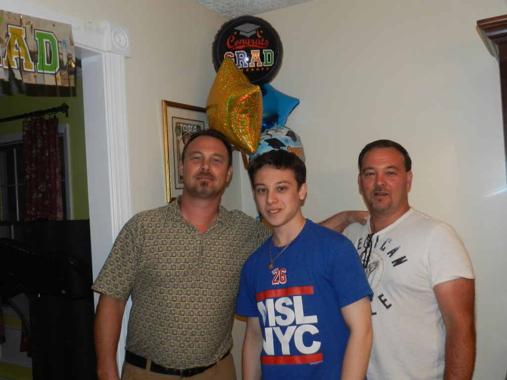 Freddy with family at his graduation party